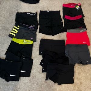 Bundle of 15 spandex shorts (Lululemon, Nike, Alo, EastBay). Most worn, one NWT.